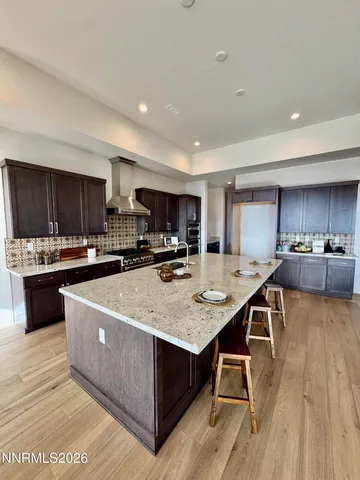a spacious bedroom with a bed and a large window