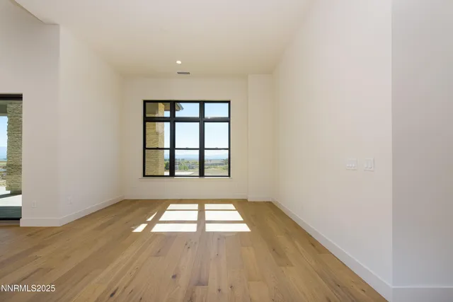 a view of a lake with houses in the back