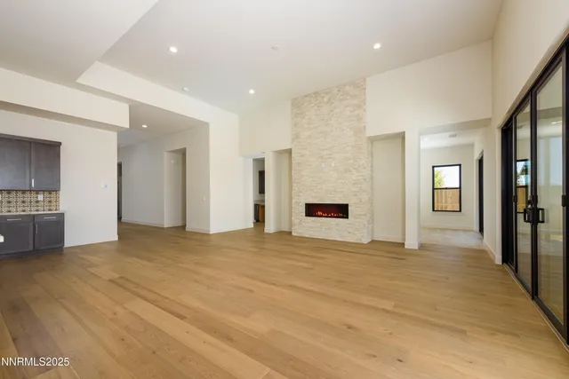 a kitchen with granite countertop sink and cabinets