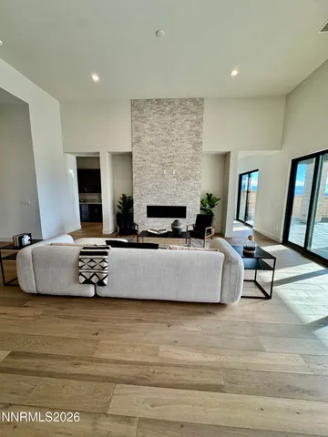 a living room with furniture and large window