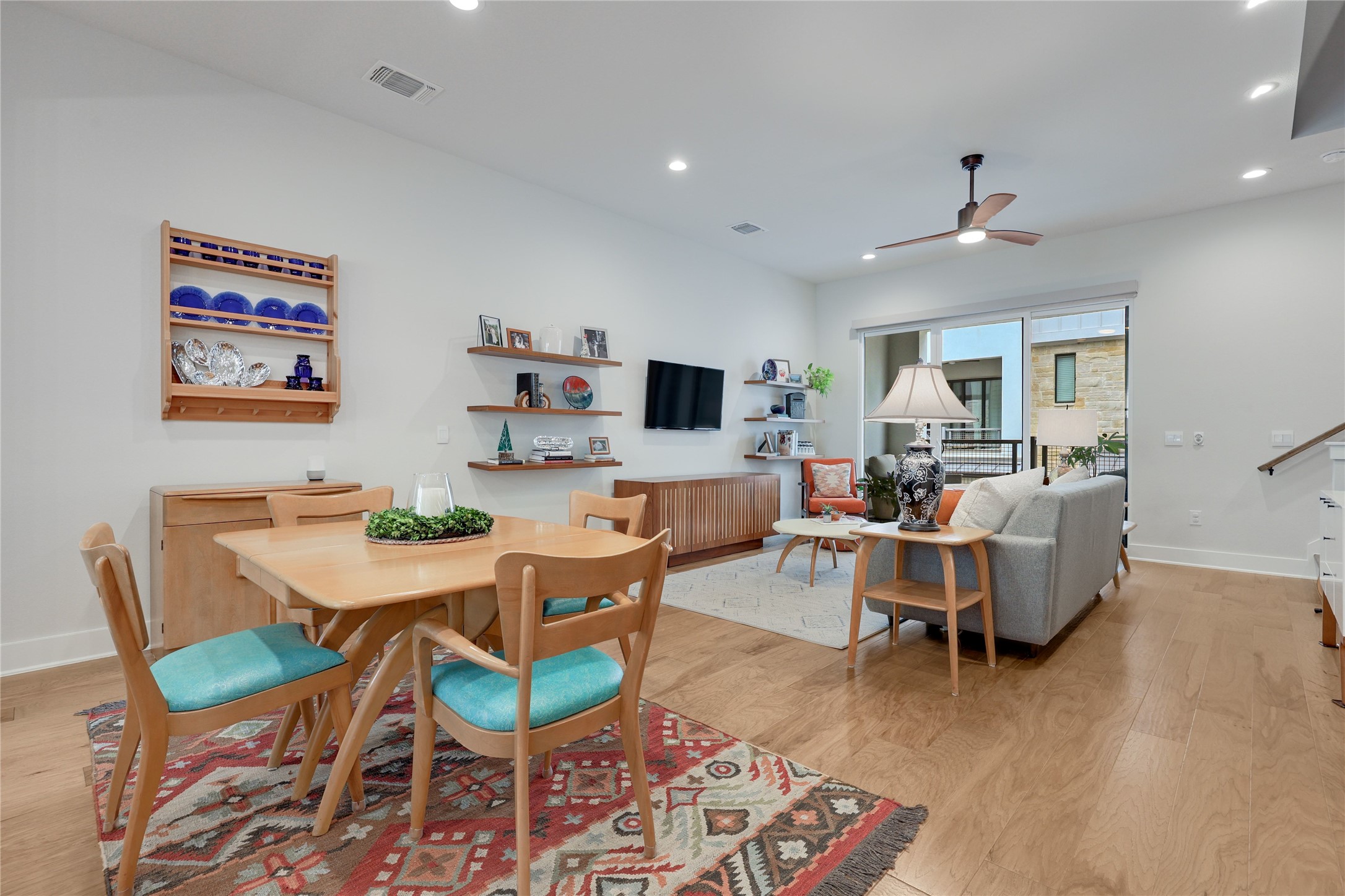 3904 Sightline Street, Unit 125 Austin, TX 78731 - Photo 13 of 37 a living room with furniture and a wooden floor