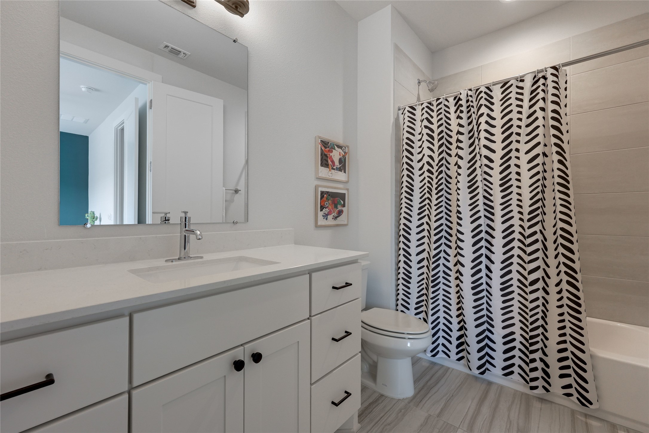 3904 Sightline Street, Unit 125 Austin, TX 78731 - Photo 29 of 37 a bathroom with a granite countertop sink toilet and a mirror