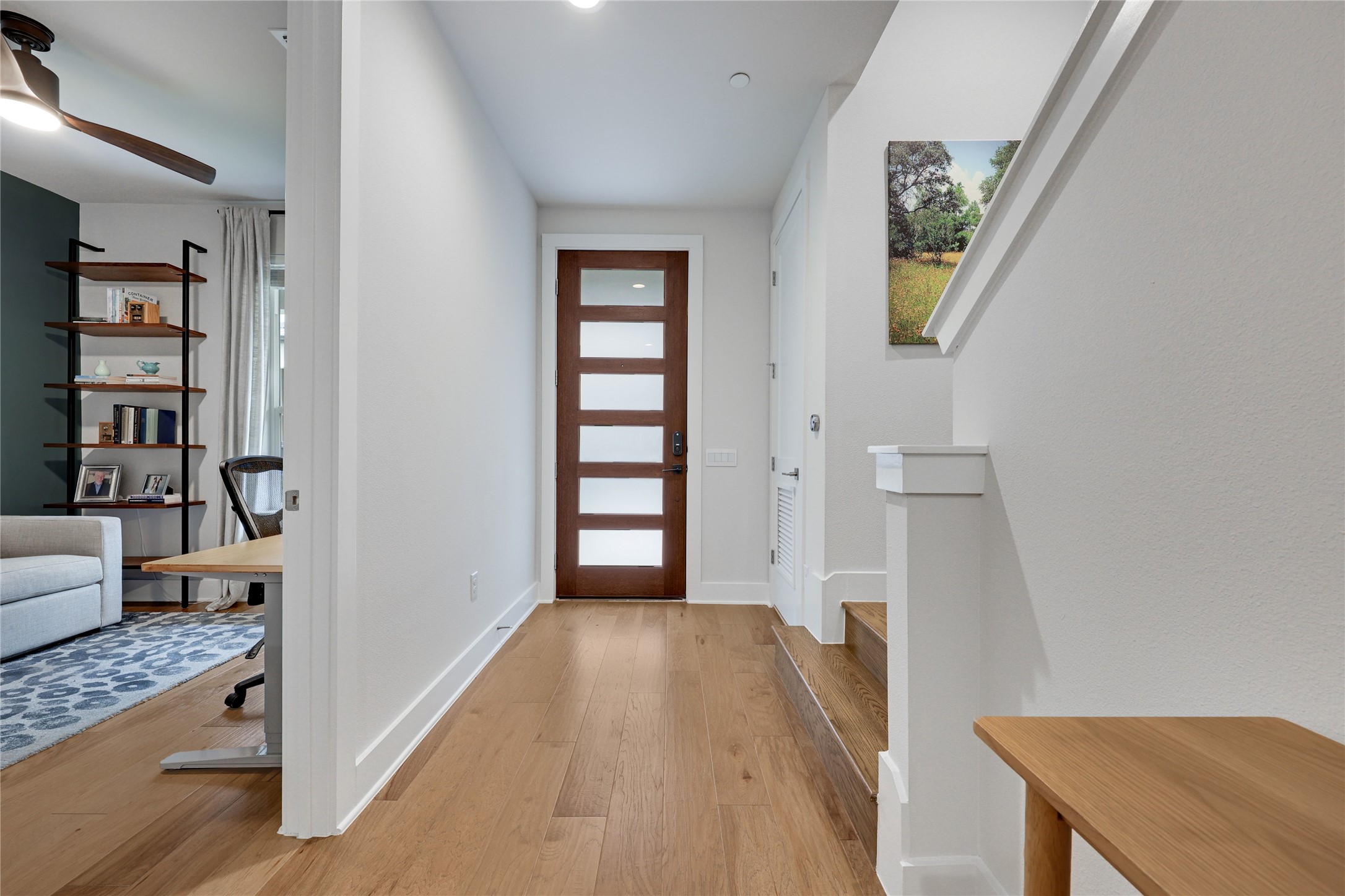 3904 Sightline Street, Unit 125 Austin, TX 78731 - Photo 4 of 37 a view of hallway with wooden floor and furniture