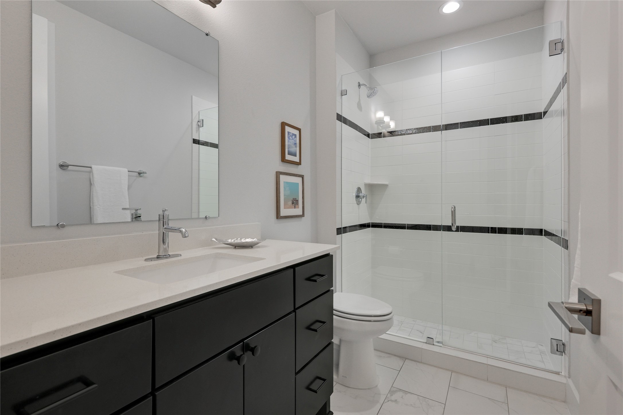3904 Sightline Street, Unit 125 Austin, TX 78731 - Photo 6 of 37 a bathroom with a sink a toilet a mirror and shower
