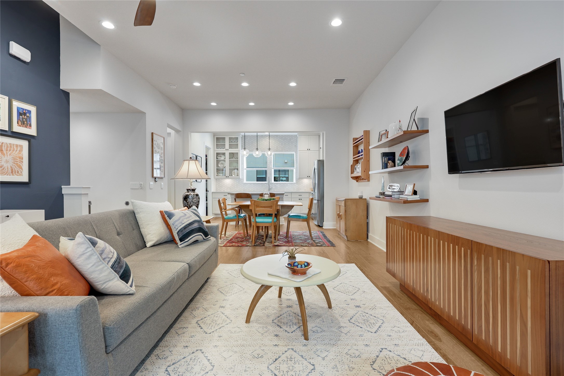 3904 Sightline Street, Unit 125 Austin, TX 78731 - Photo 9 of 37 a living room with furniture and a flat screen tv