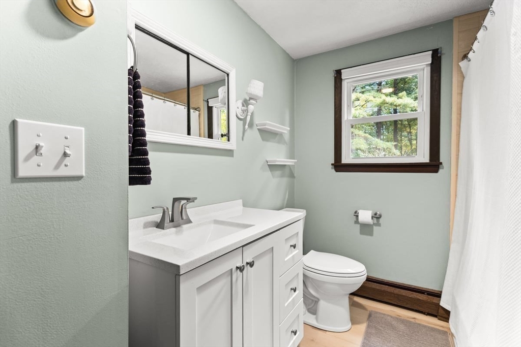 10 Dean Street Freetown, MA 02702 - Photo 17 of 26 a bathroom with a toilet sink and mirror