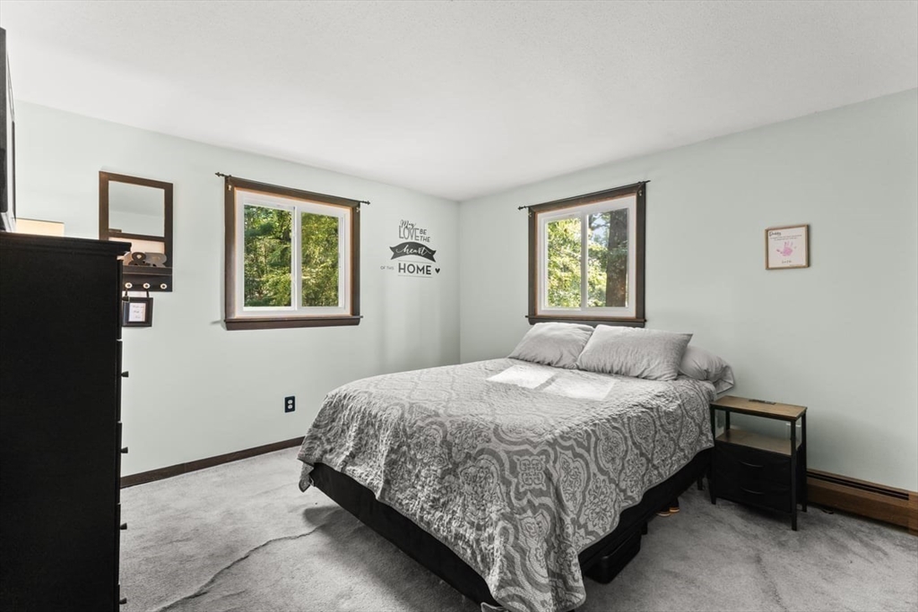 10 Dean Street Freetown, MA 02702 - Photo 9 of 26 a bedroom with a bed and a window