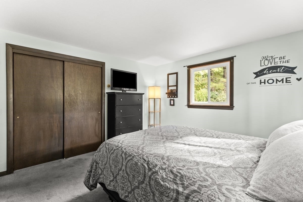 10 Dean Street Freetown, MA 02702 - Photo 10 of 26 a bedroom with a bed and a flat screen tv