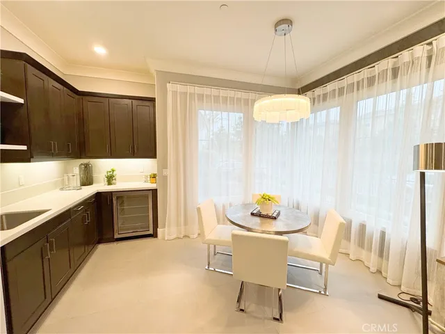 a kitchen with a table and chairs
