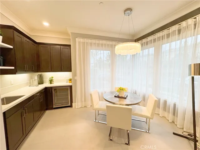a kitchen with a table and chairs