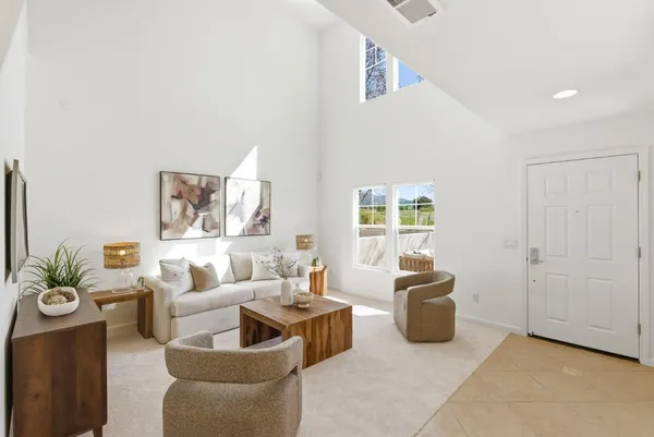 a living room with furniture and a couch