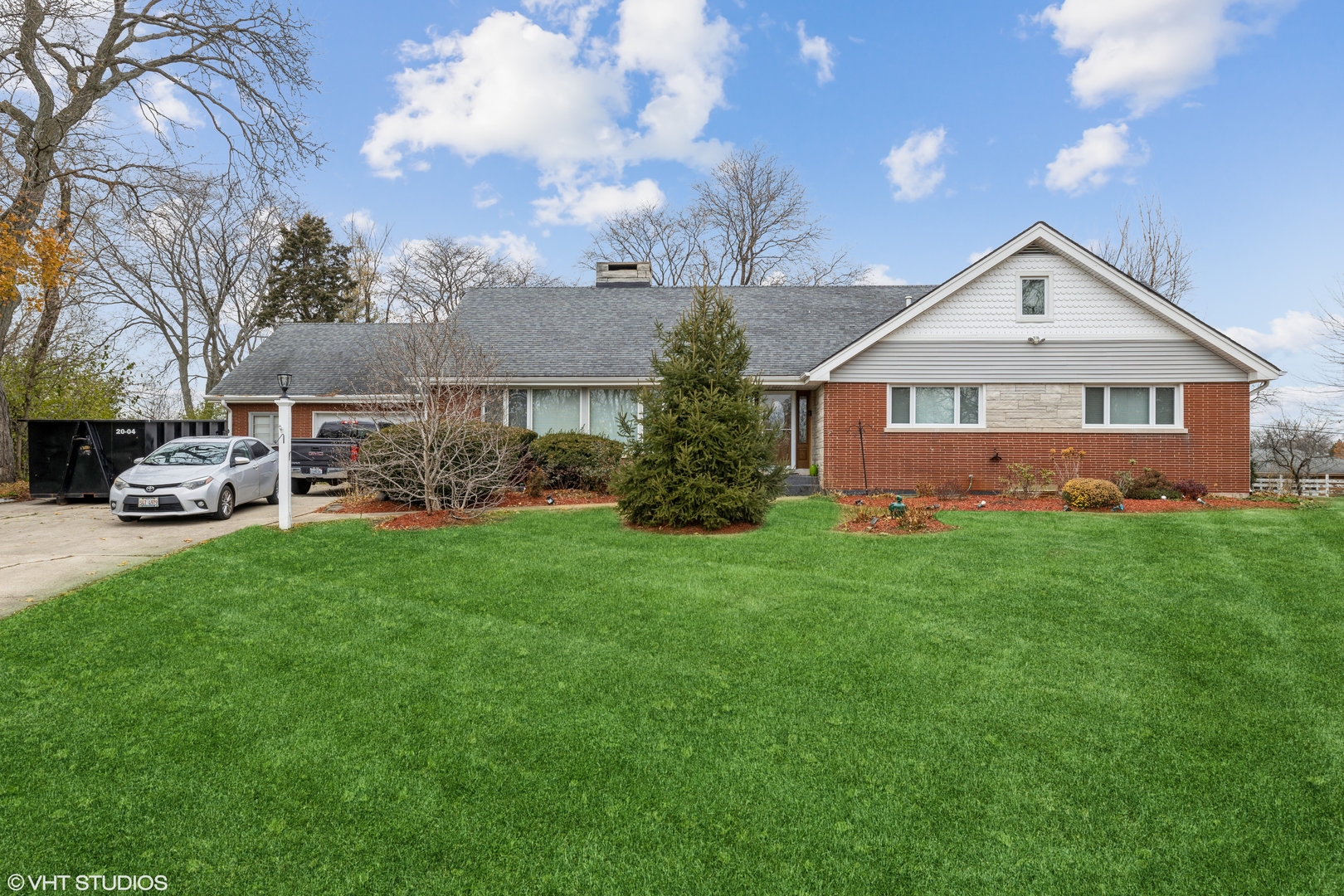 6310 Thurlow Street Willowbrook, IL 60527 - Photo 1 of 34 a front view of house with yard and green space