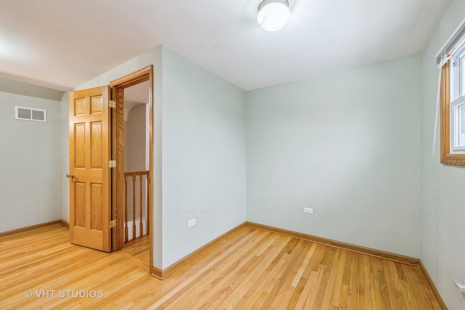 6310 Thurlow Street Willowbrook, IL 60527 - Photo 21 of 34 a view of a room with wooden floor and windows