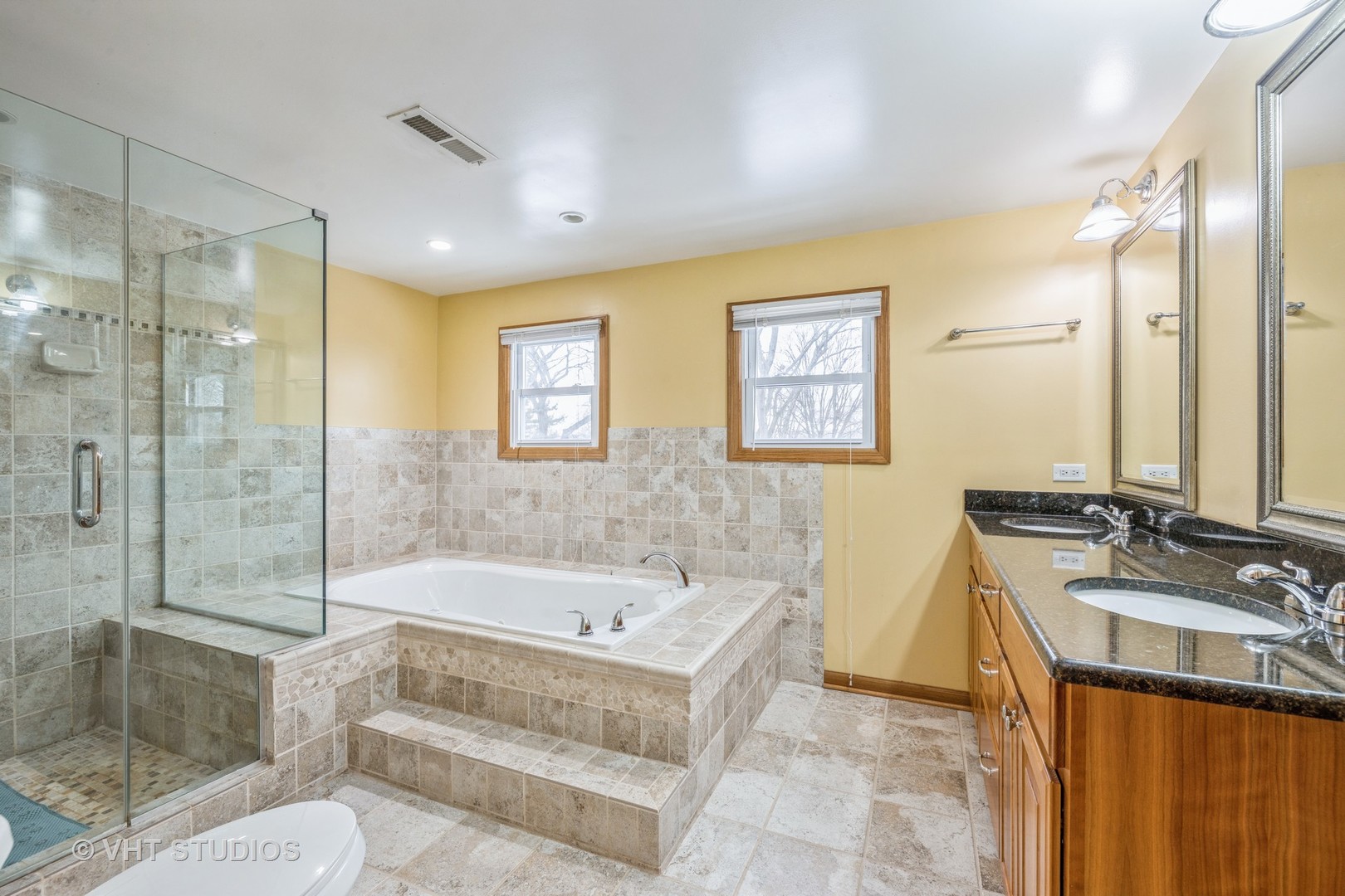 6310 Thurlow Street Willowbrook, IL 60527 - Photo 22 of 34 a bathroom with a tub sink mirror and a shower