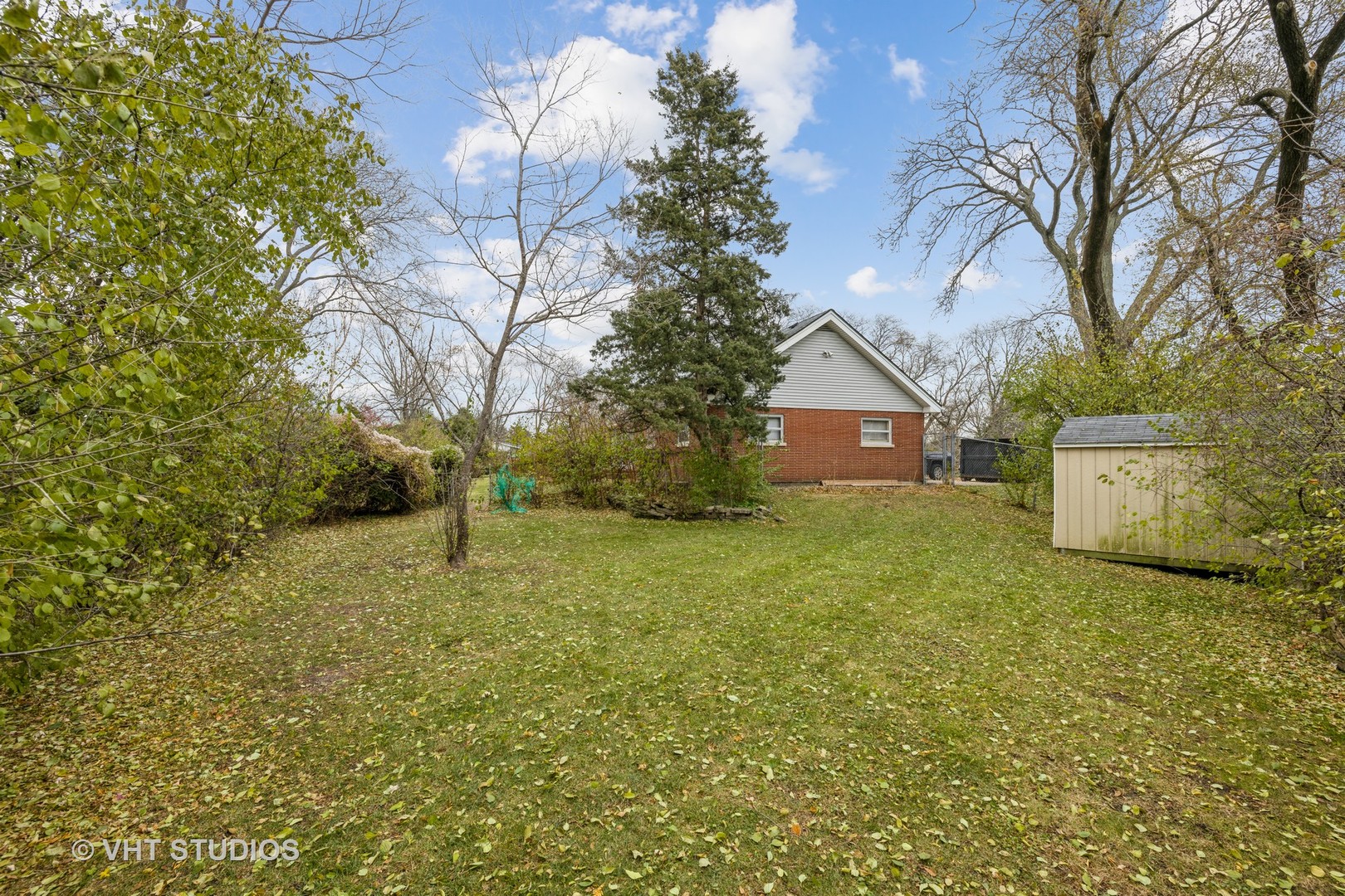 6310 Thurlow Street Willowbrook, IL 60527 - Photo 30 of 34 a view of a house with a yard
