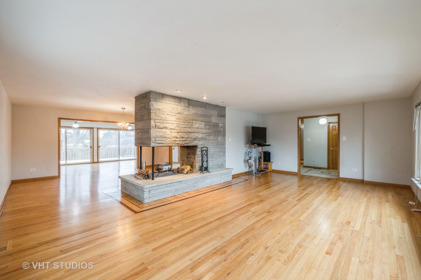 6310 Thurlow Street Willowbrook, IL 60527 - Photo 5 of 34 a view of empty room with wooden floor and fireplace