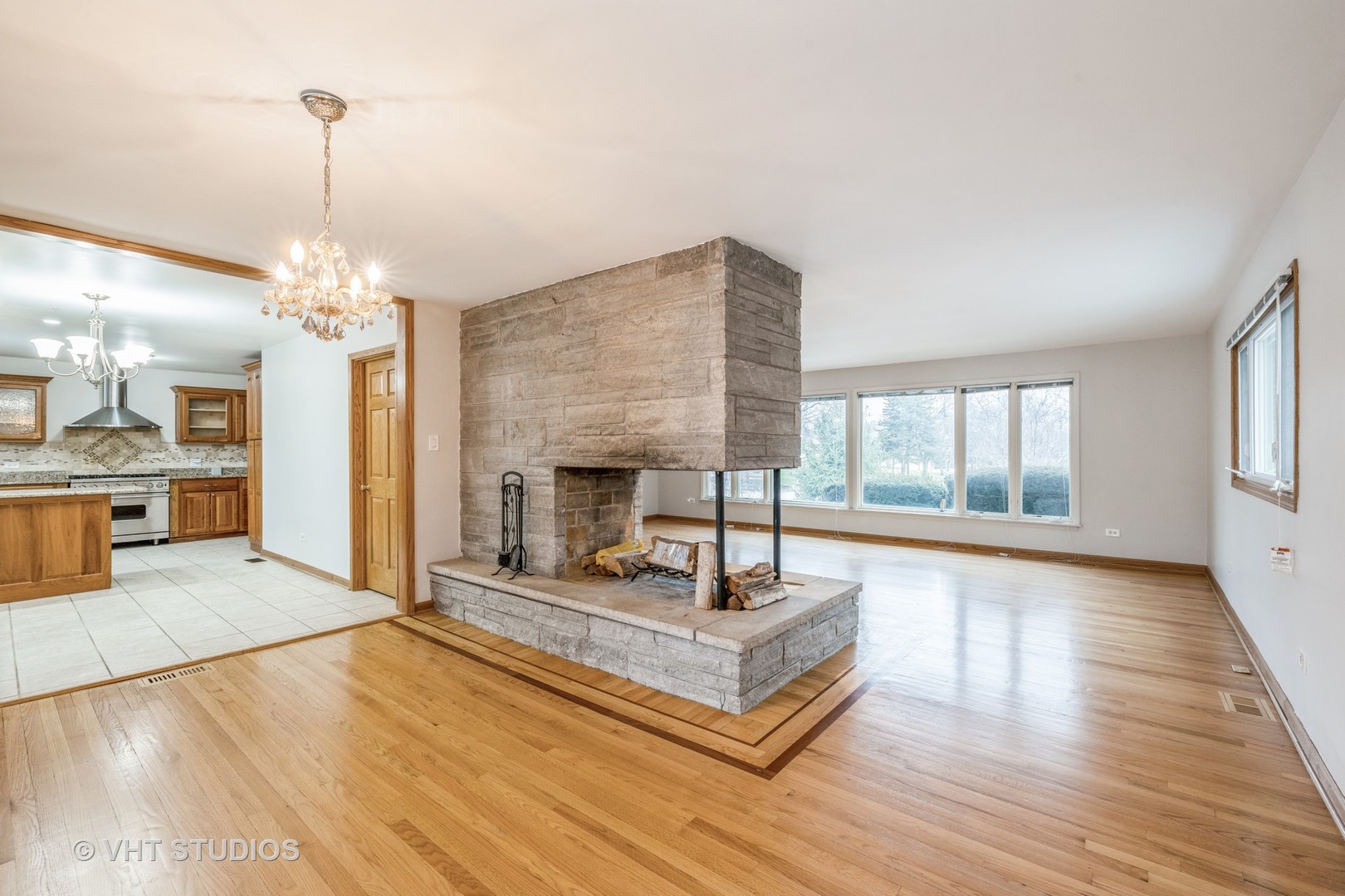 6310 Thurlow Street Willowbrook, IL 60527 - Photo 7 of 34 a living room with furniture and a chandelier