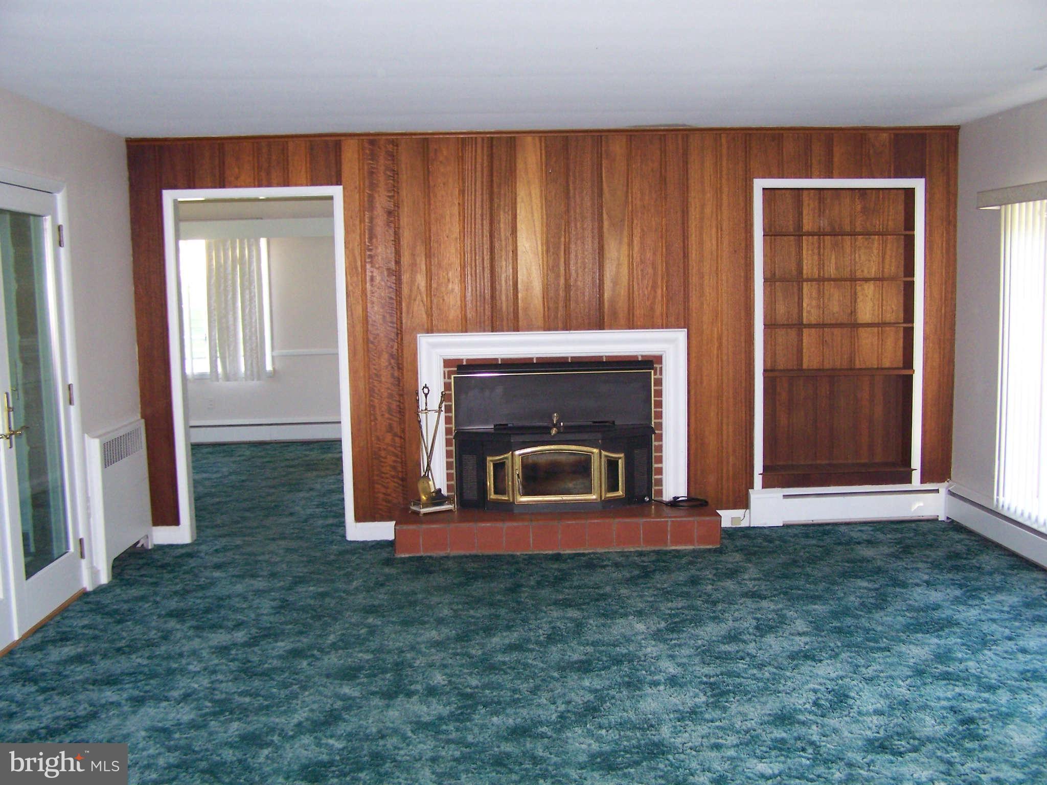 3117 Rices Lane Baltimore, MD 21244 - Photo 12 of 23 an empty room with fireplace