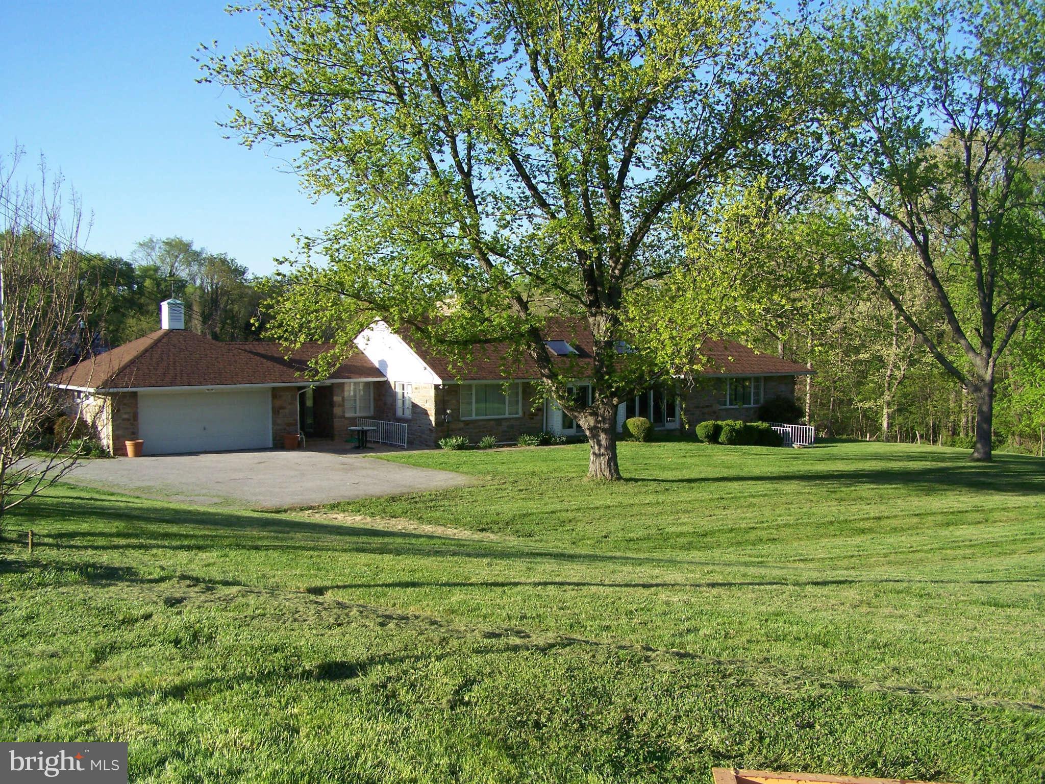 3117 Rices Lane Baltimore, MD 21244 - Photo 4 of 23 a front view of a house with a yard