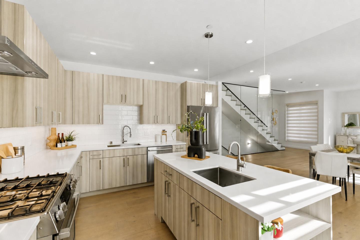 914 Woodside Road Redwood City, CA 94061 - Photo 12 of 39 a kitchen that has a sink and a stove in it