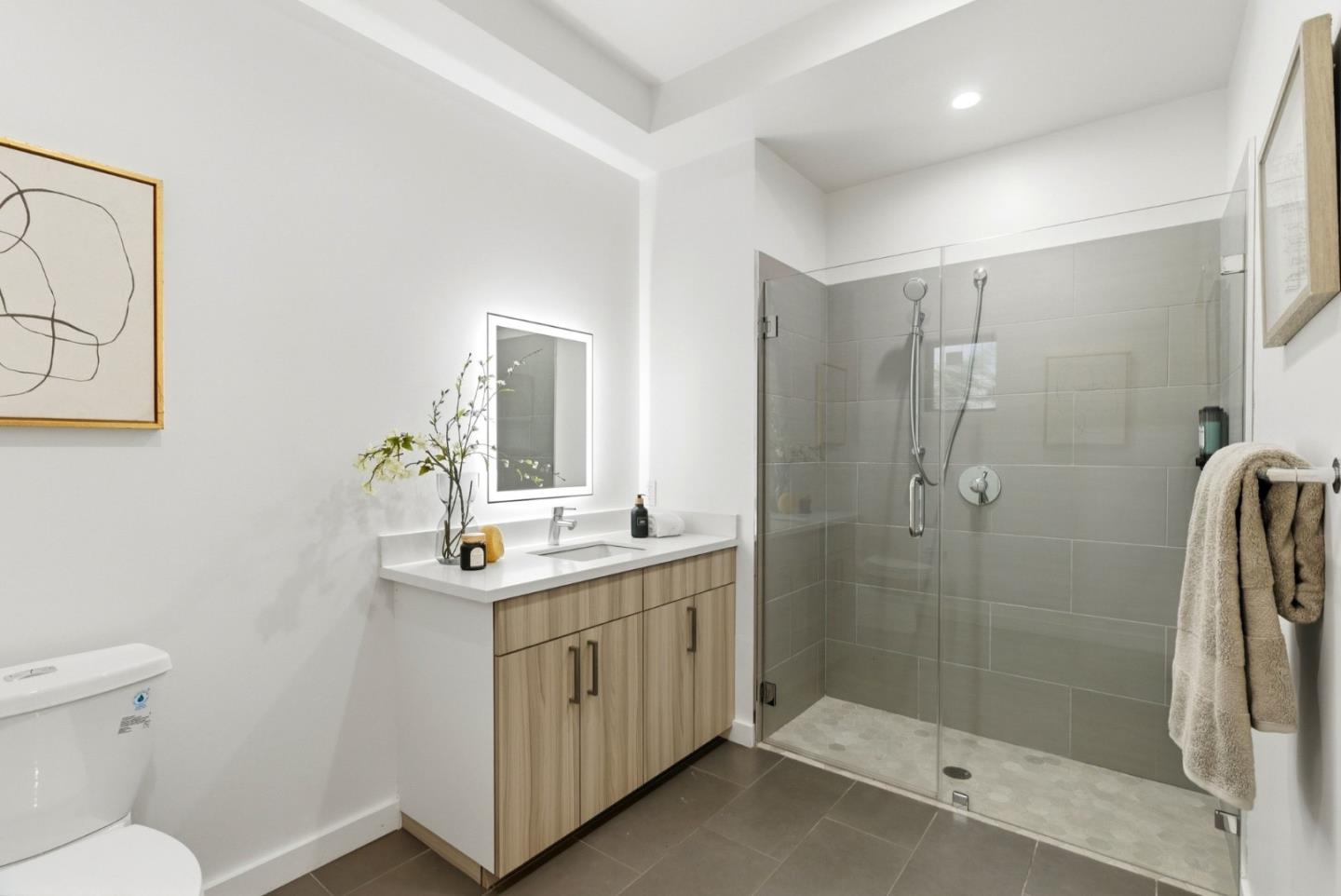 914 Woodside Road Redwood City, CA 94061 - Photo 23 of 39 a bathroom with a sink toilet and shower