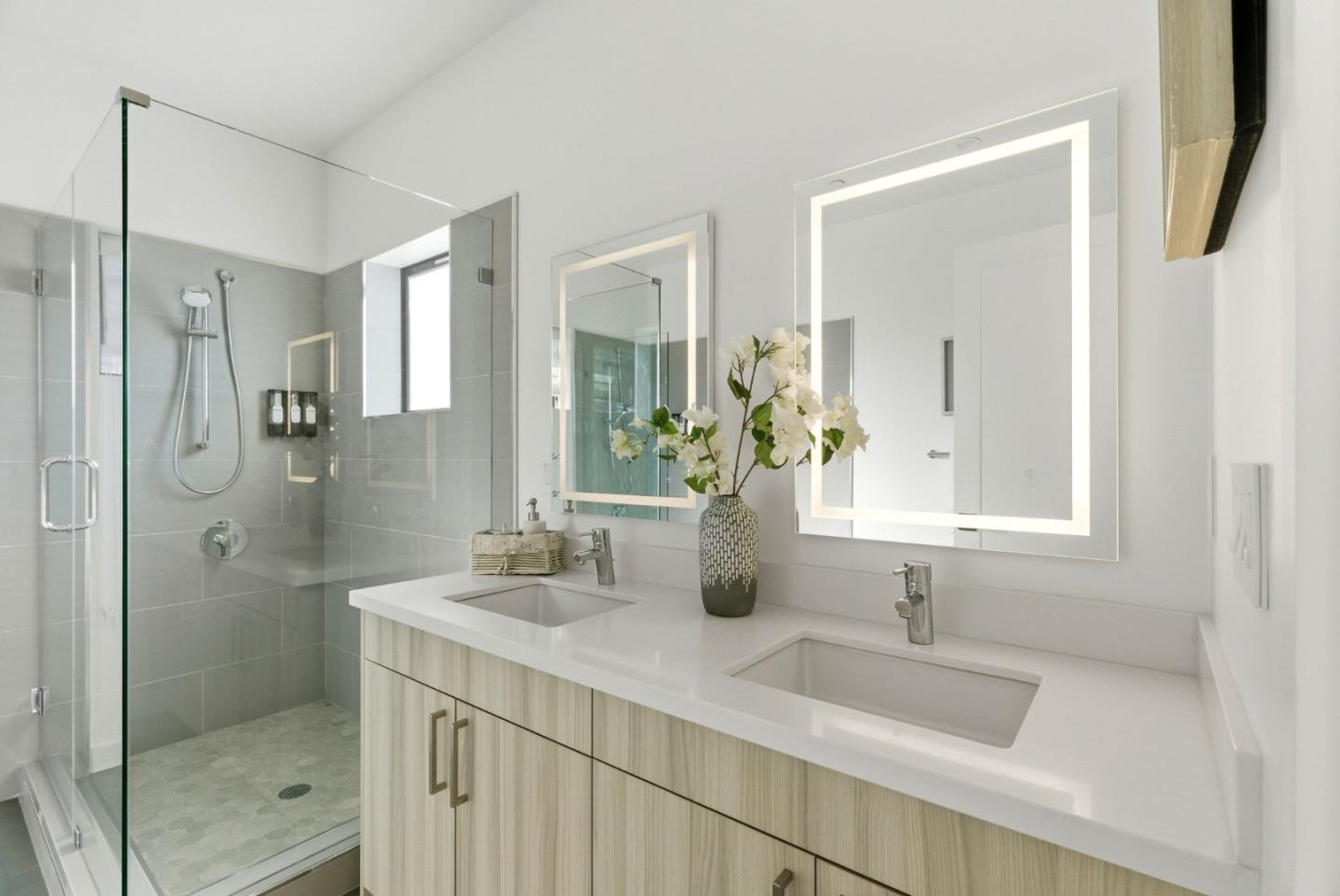 914 Woodside Road Redwood City, CA 94061 - Photo 24 of 39 a bathroom with double vanity sink and mirror