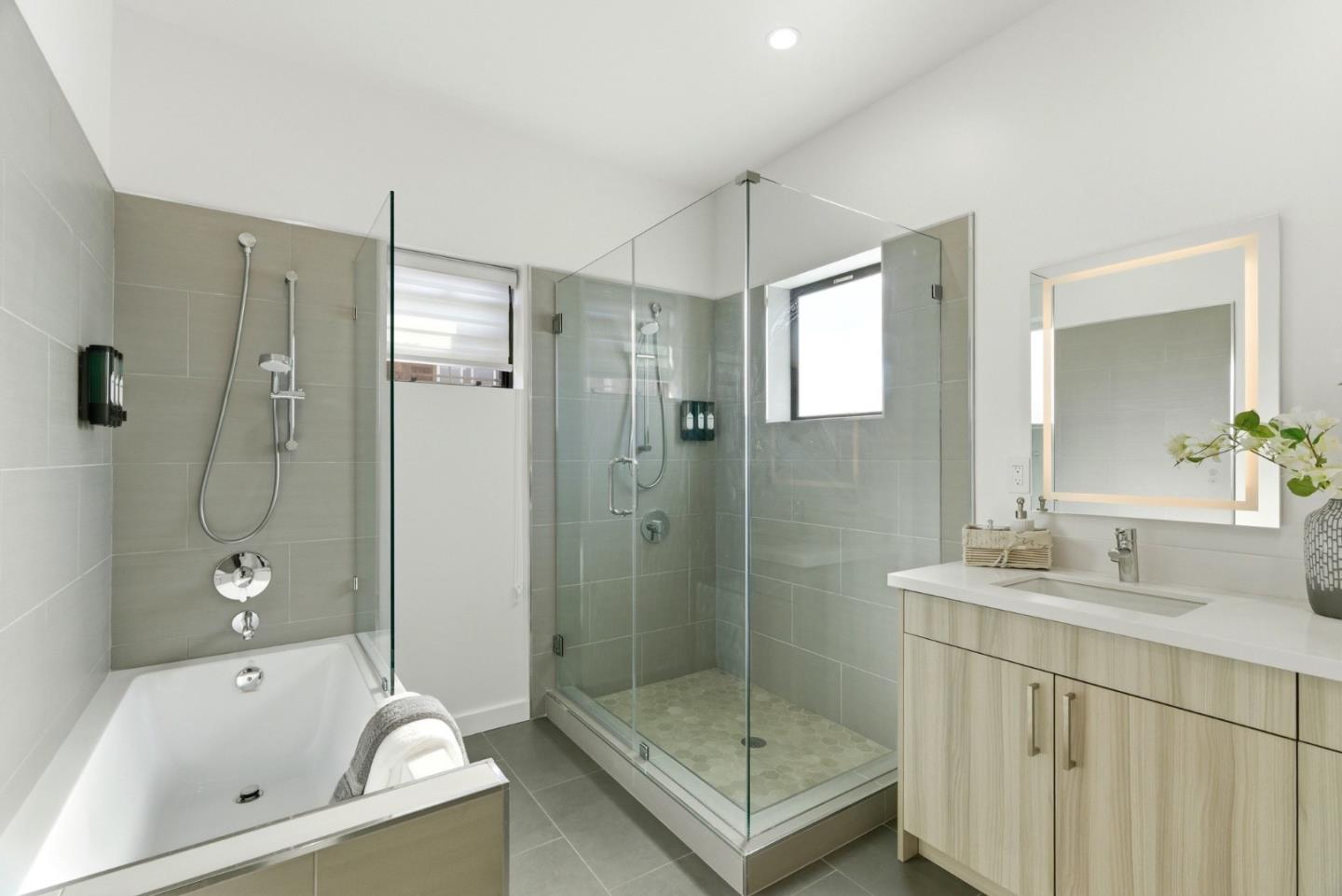 914 Woodside Road Redwood City, CA 94061 - Photo 26 of 39 a bathroom with a tub sink shower and mirror