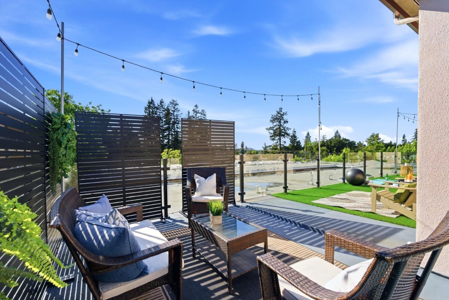 914 Woodside Road Redwood City, CA 94061 - Photo 33 of 39 a view of a patio with table and chairs and potted plants