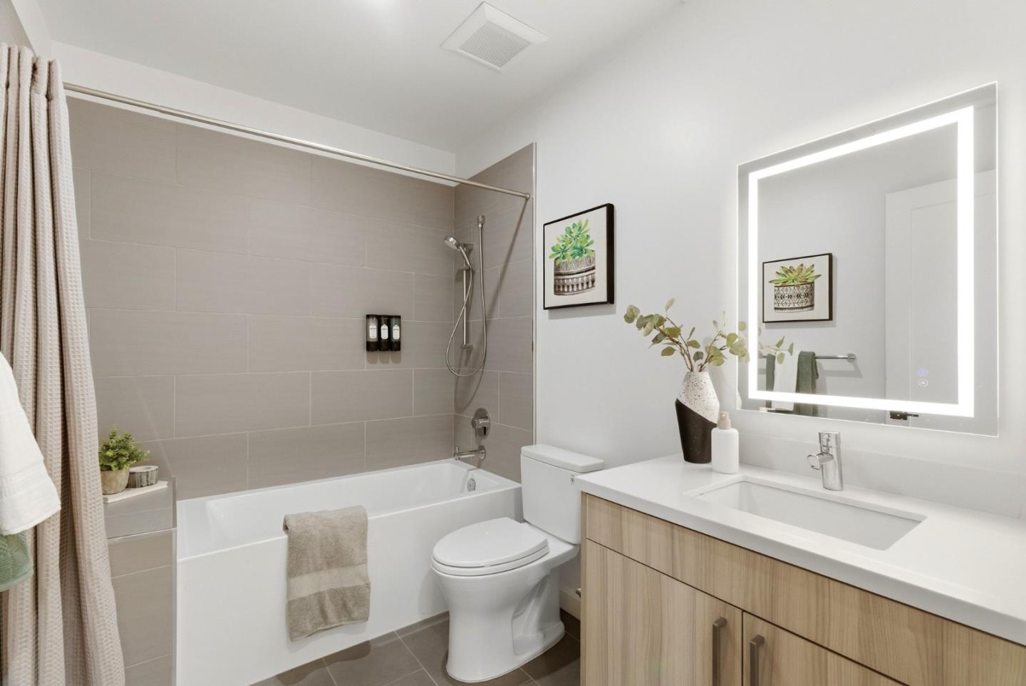 914 Woodside Road Redwood City, CA 94061 - Photo 9 of 39 a bathroom with a sink a toilet and shower
