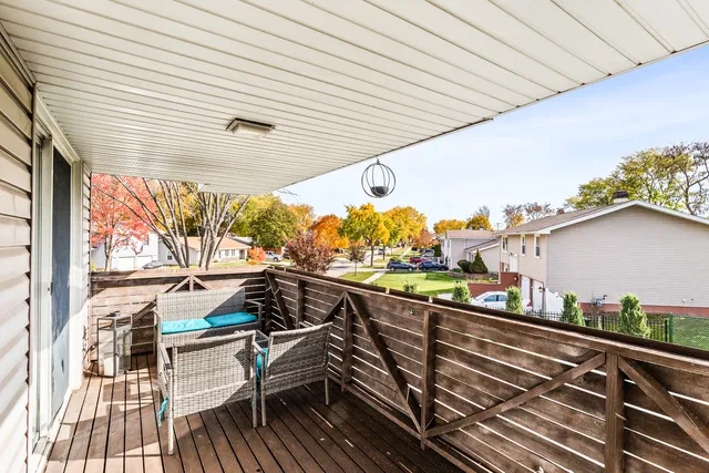 a view of a balcony with furniture