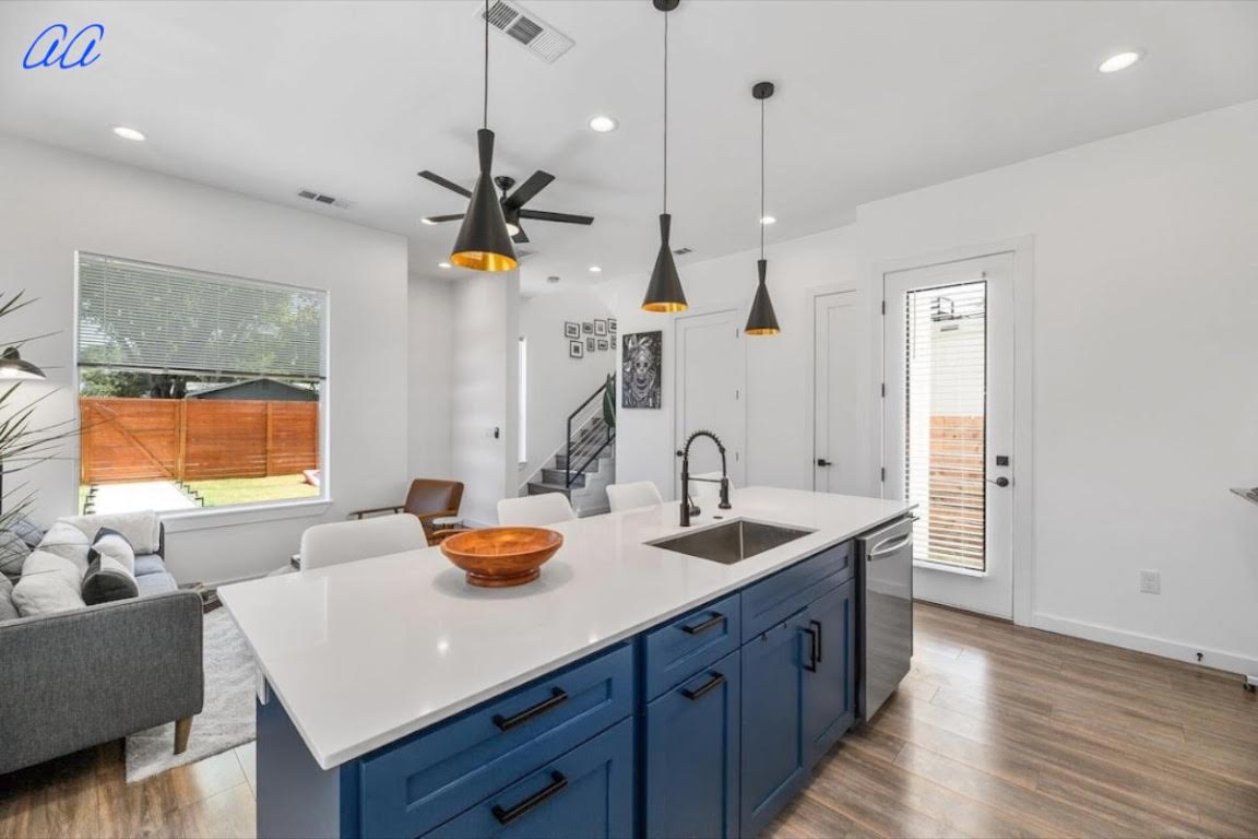 5401 Stuart Circle, Unit 1 Austin, TX 78721 - Photo 24 of 24 a kitchen with a sink a counter space and living room view