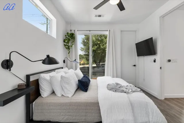 a bedroom with a bed and a dresser