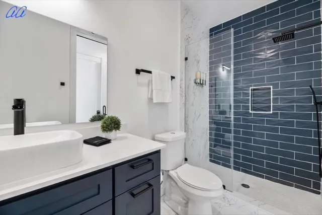 a bedroom with a bed and a potted plant