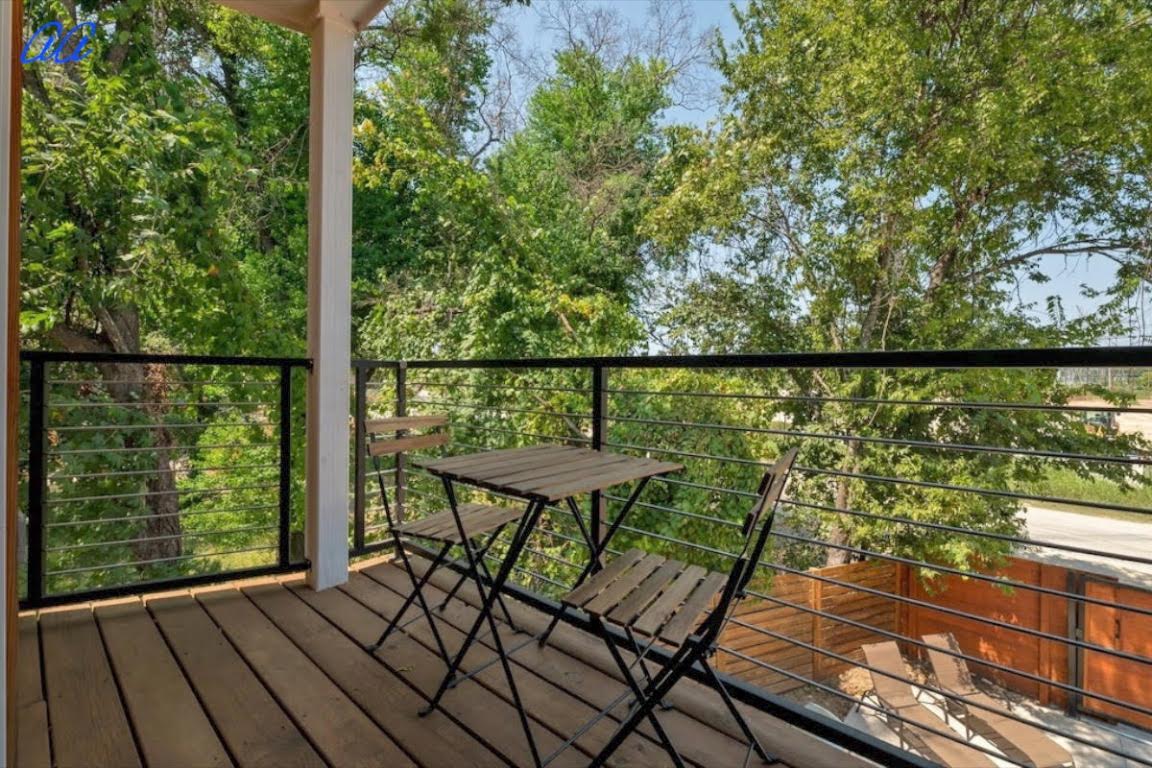 5401 Stuart Circle, Unit 1 Austin, TX 78721 - Photo 21 of 24 a view of a balcony with wooden floor and outdoor seating
