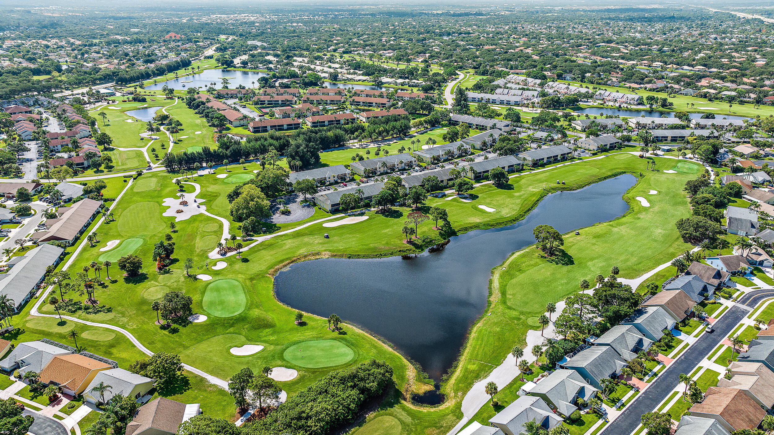 1072 Keystone Drive, Unit D Jupiter, FL 33458 - Photo 27 of 28 Views of lake and golf course from patio