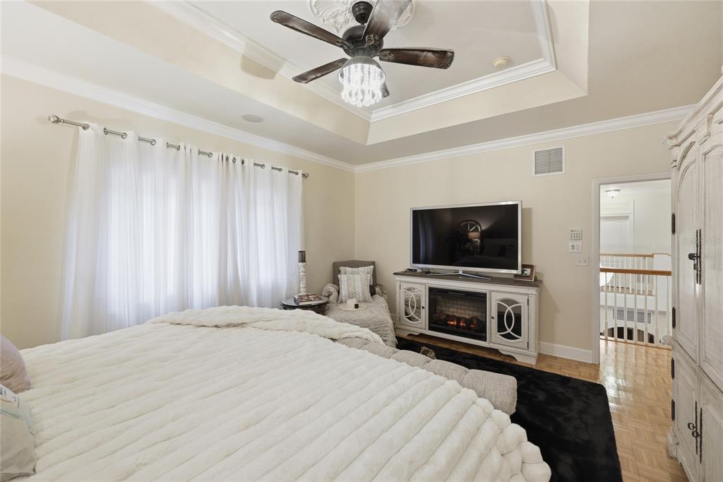9278 Southwest 61st Avenue Gainesville, FL 32608 - Photo 43 of 70 a bedroom with a bed and a flat screen tv