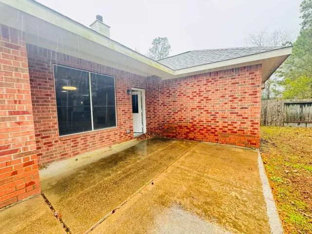 a view of yellow house with front of house