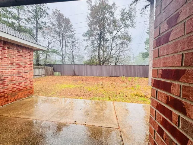 a view of a swimming pool with an outdoor space and seating area