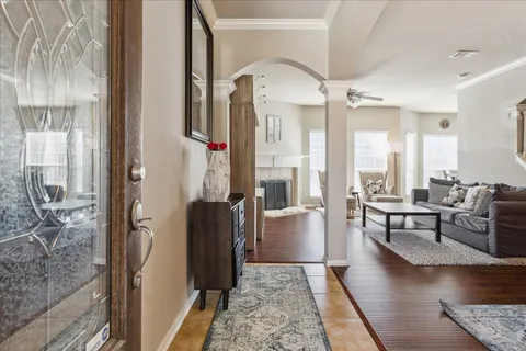 a living room with furniture and a rug