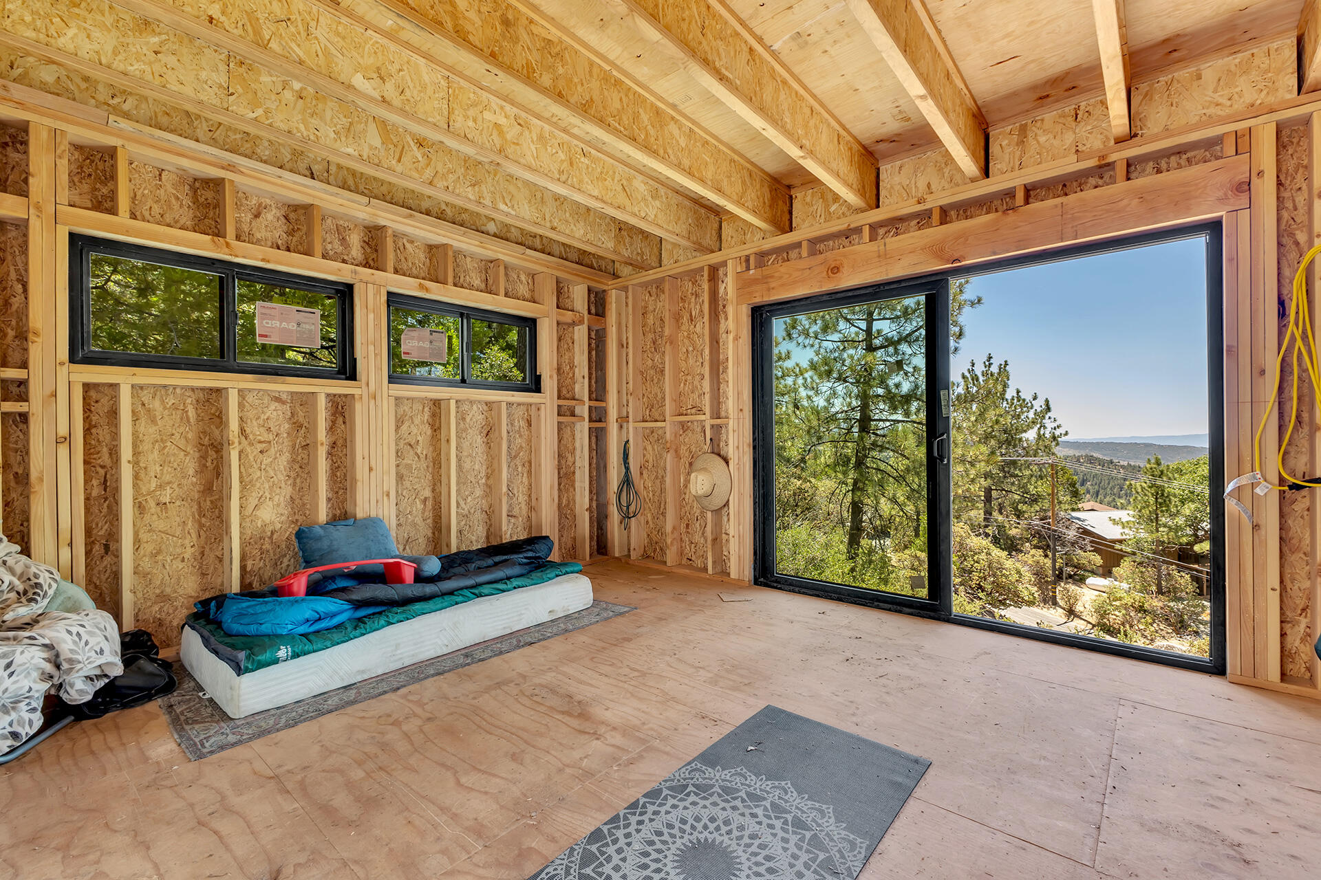 54174 North Ridge Drive Idyllwild, CA 92549 - Photo 15 of 33 a blue bench sitting in front of a building