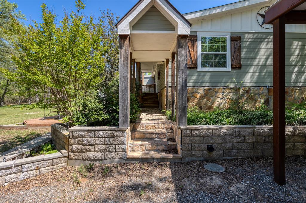 1701 Central Road Weatherford, TX 76088 - Photo 31 of 40 Covered stone steps and entry to the back porch.
