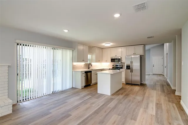 a large kitchen with lots of counter space and appliances