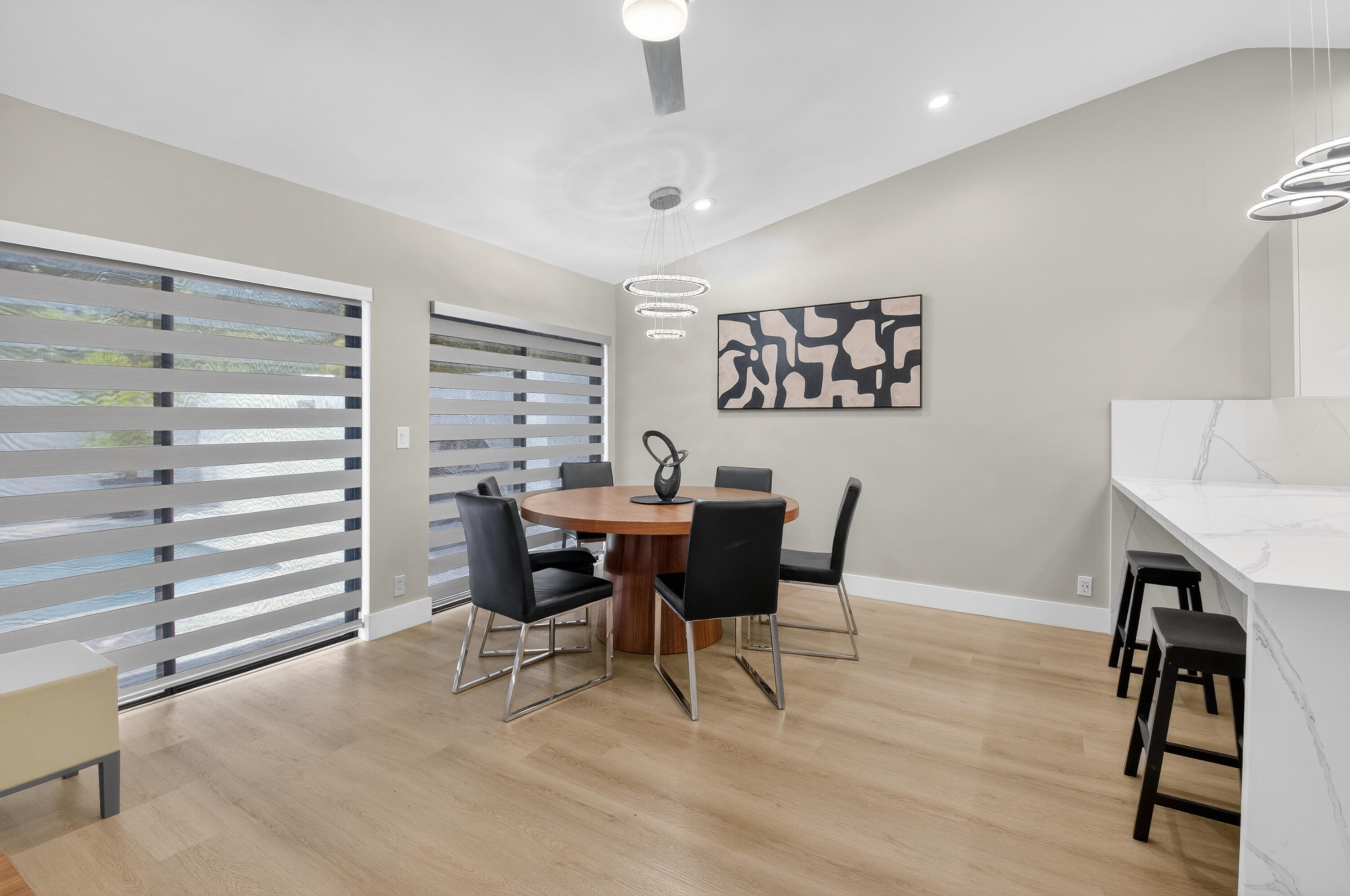 7374 Woodmont Court Boca Raton, FL 33434 - Photo 10 of 95 a view of a dining room with furniture and wooden floor