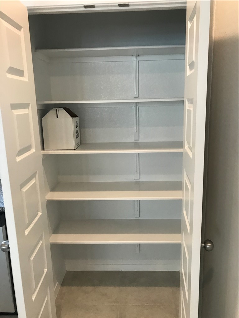 1353 Goforth Road Kyle, TX 78640 - Photo 11 of 24 a view of walk in closet with empty racks