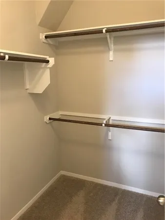 a view of a room with racks on the wall
