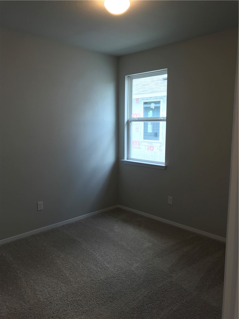 1353 Goforth Road Kyle, TX 78640 - Photo 18 of 24 an empty room with a window