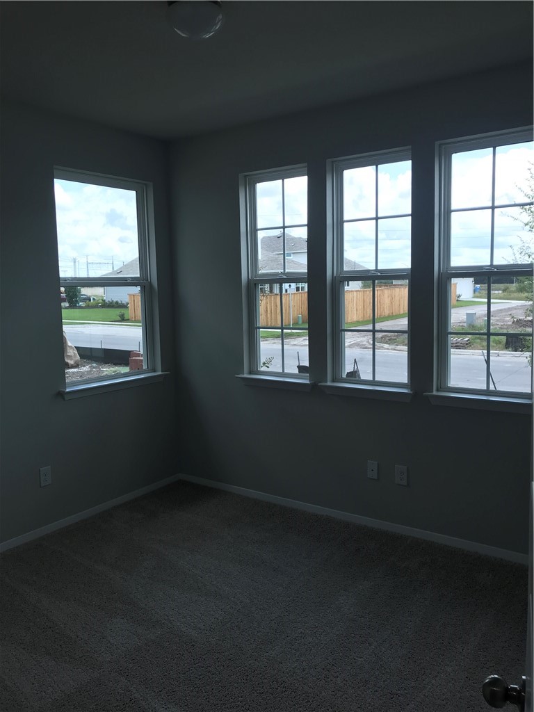1353 Goforth Road Kyle, TX 78640 - Photo 5 of 24 a view of an empty room with a window