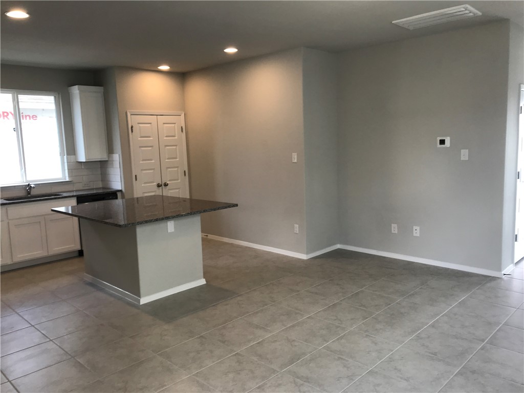 1353 Goforth Road Kyle, TX 78640 - Photo 7 of 24 a view of an empty room and window