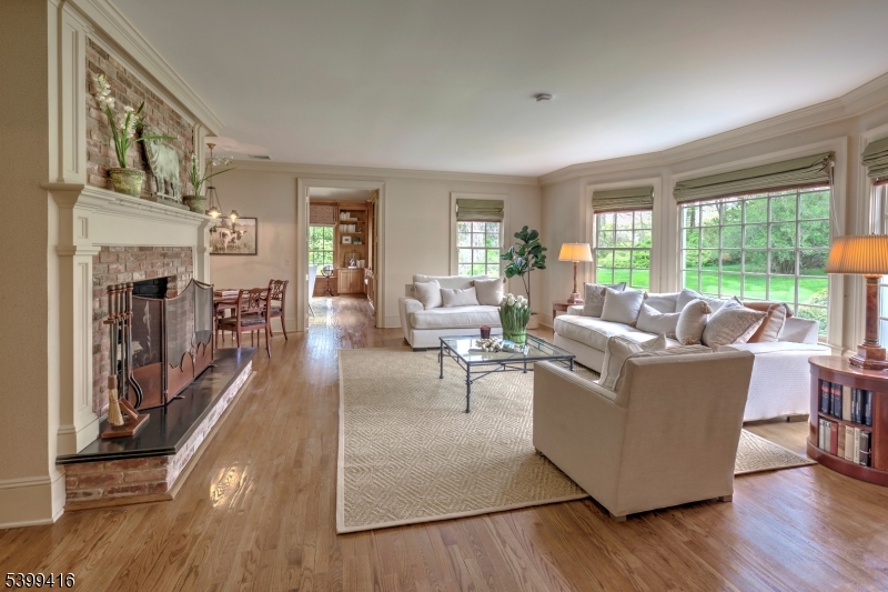 46 Sand Spring Road Morristown, NJ 07960 - Photo 12 of 38 a living room with furniture large window and wooden floor