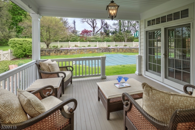46 Sand Spring Road Morristown, NJ 07960 - Photo 13 of 38 a view of a patio with couches chairs and wooden floor